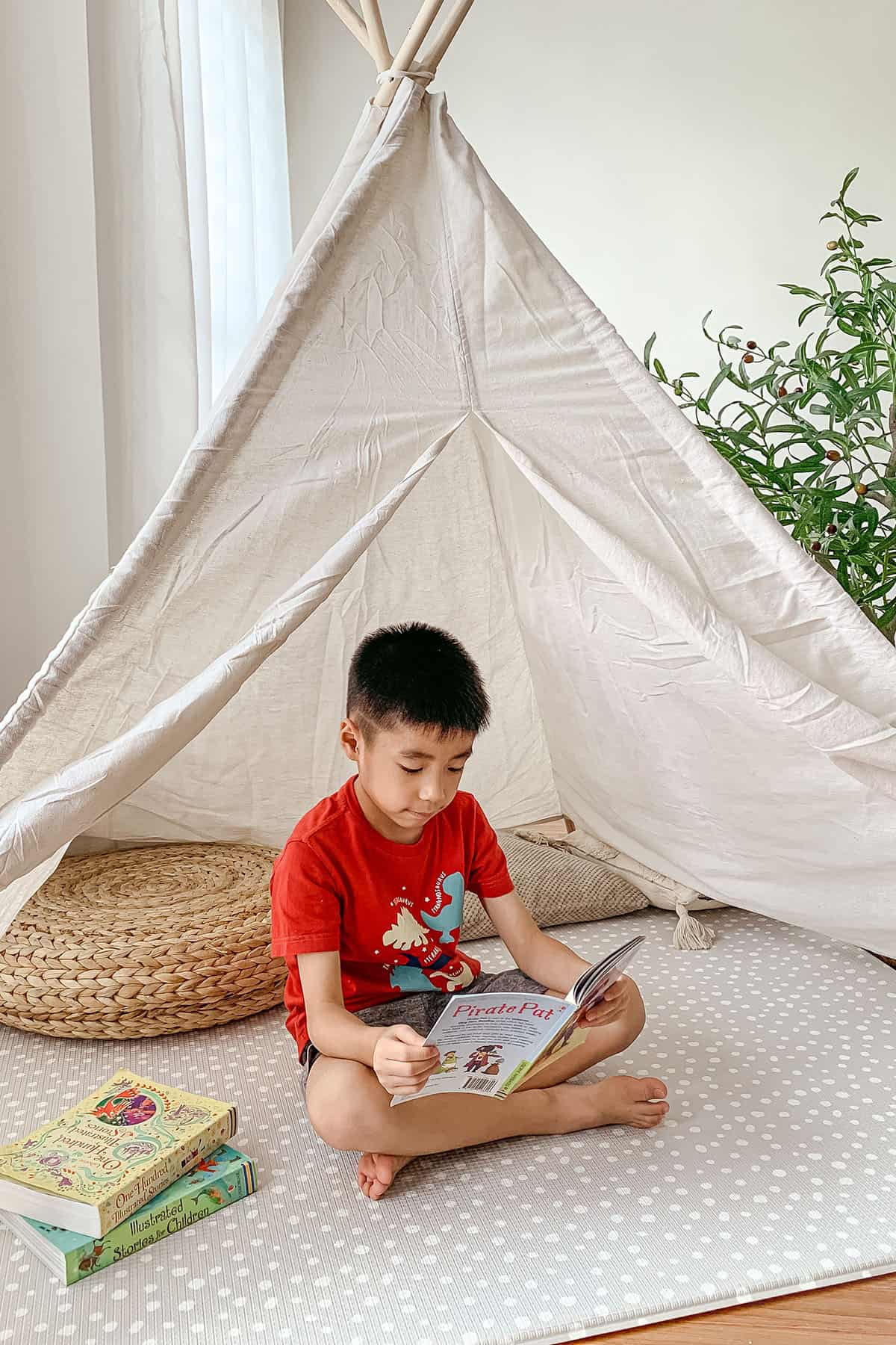 good baby play mat boy reading on it